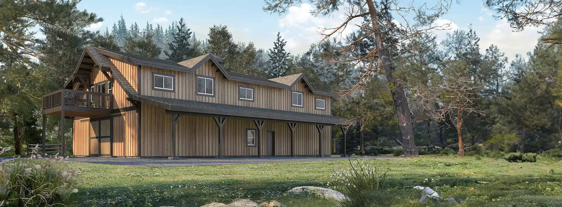 A large wooden house with a covered porch and balcony sits in a grassy clearing surrounded by tall pine trees under a blue sky.