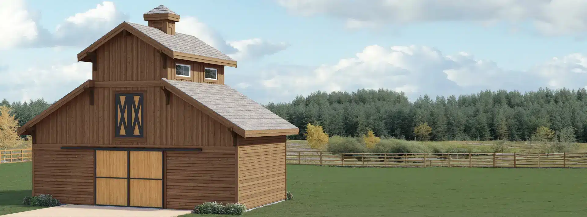 A wooden barn with double doors stands on a grassy field, surrounded by a wooden fence and backed by trees under a partly cloudy sky.