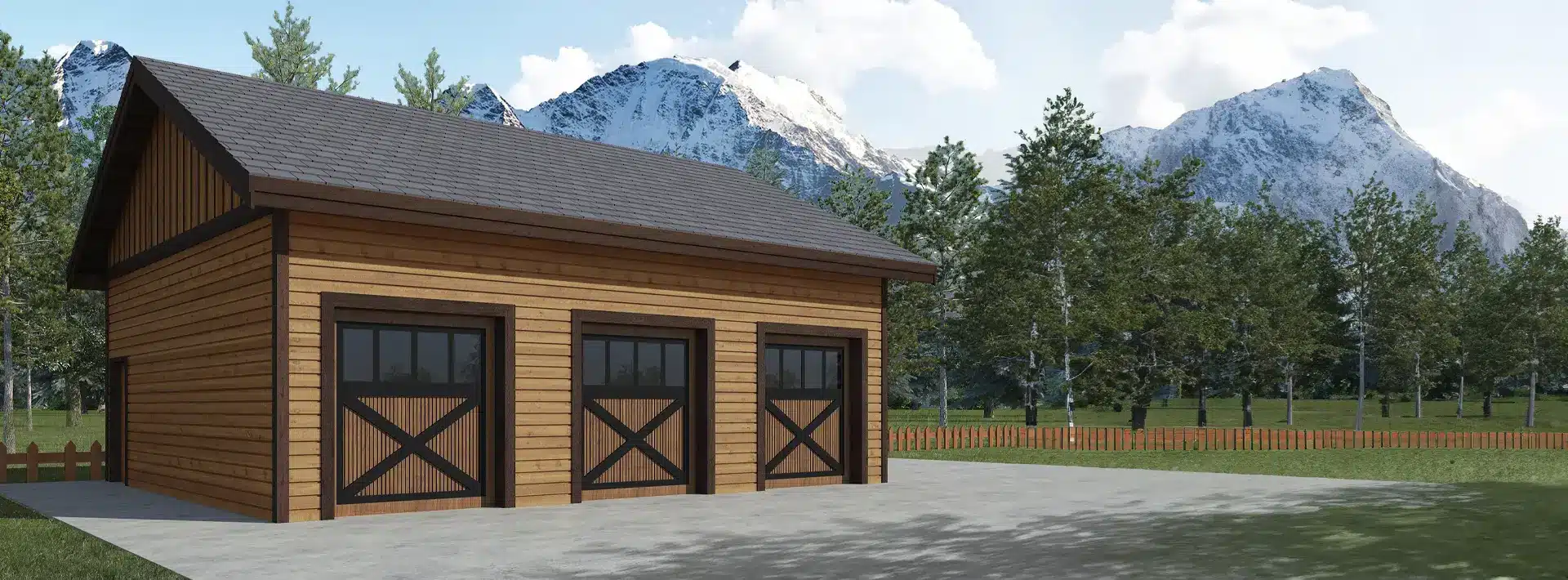 A wooden three-car garage with dark trim stands on a concrete driveway, surrounded by trees and grass, with mountains in the background.