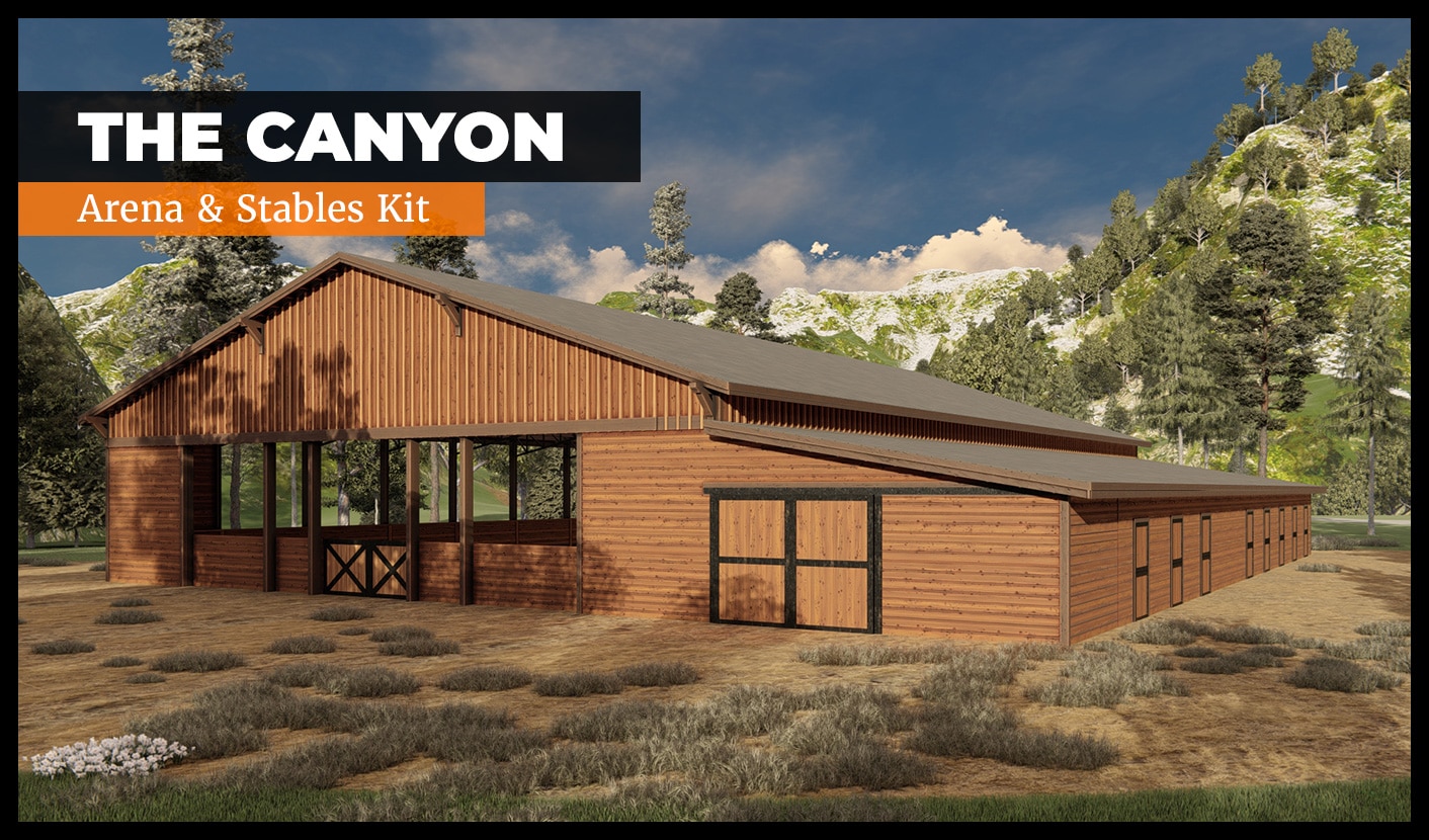 Illustration of a large wooden stable and arena building in a rural setting, surrounded by grass and trees. The sky is clear with a few clouds. Text in the upper left corner reads "The Canyon: Arena & Stables Kit.