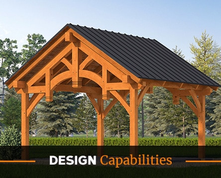 A wooden pavilion kit with a dark roof stands in a grassy area, surrounded by trees. Text at the bottom reads "DESIGN Capabilities.