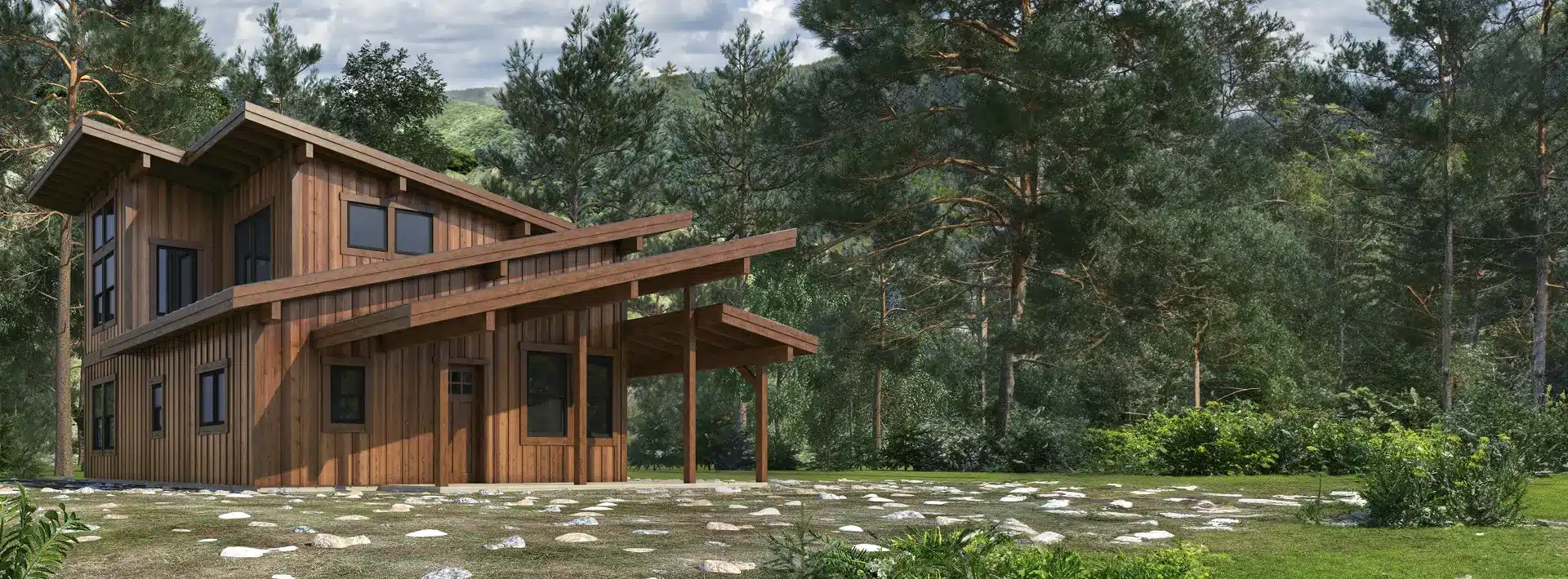Modern wooden house with large windows and slanted roofs, surrounded by pine trees and lush vegetation on a grassy, stony plot.