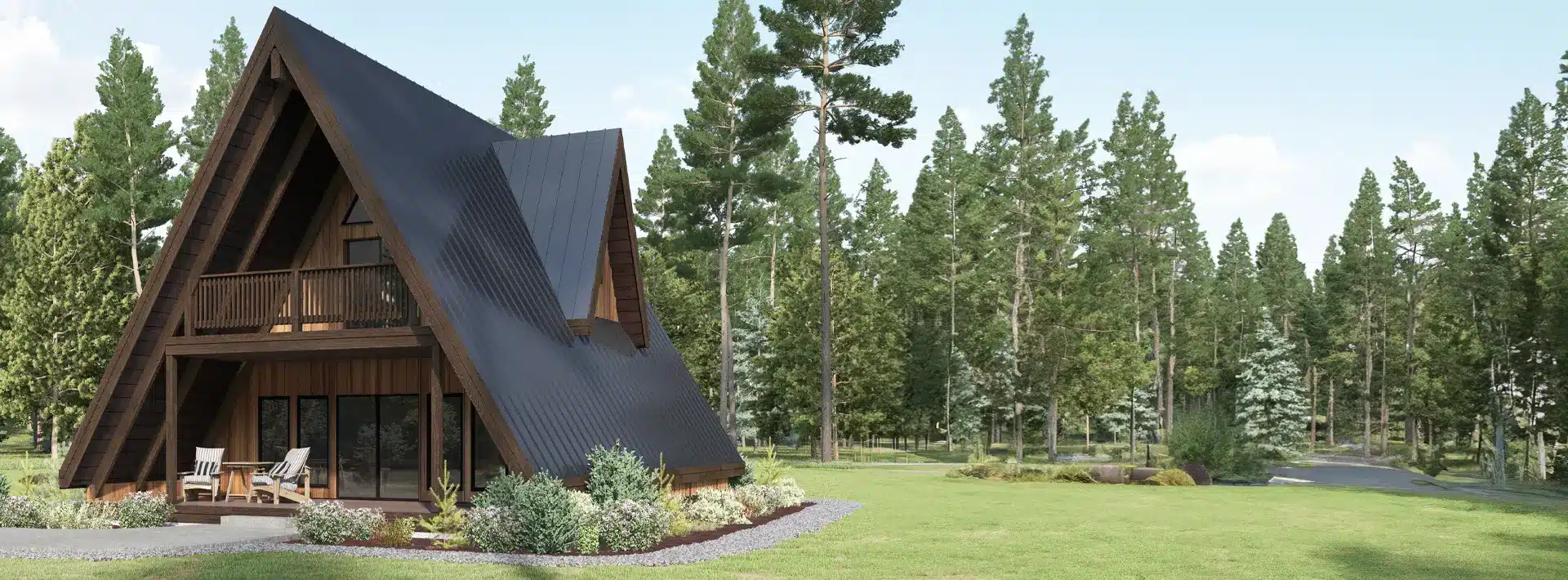 A modern A-frame cabin with large windows sits on a grassy lawn among pine trees. Outdoor chairs are on a small patio nearby.