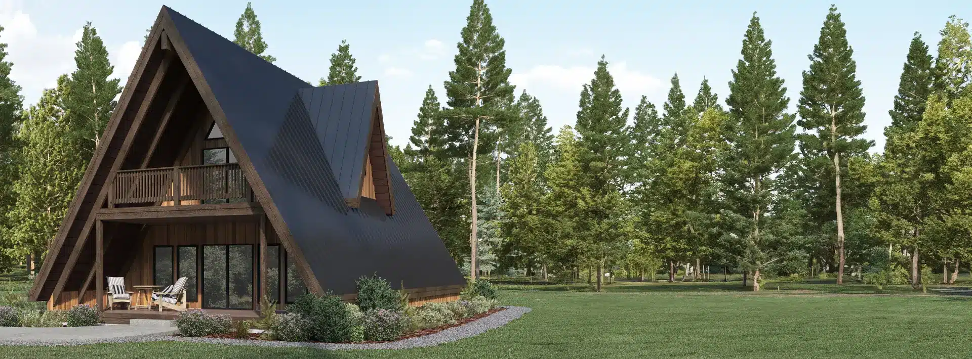 A modern A-frame cabin with large windows and a small porch sits on a grassy lawn surrounded by tall pine trees under a clear blue sky.
