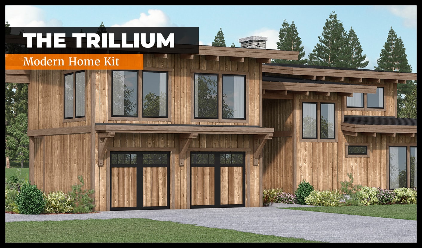 A modern, two-story wooden house with large windows and two garage doors. Surrounded by trees, the home features a rustic design. Text overlay reads "The Trillium - Modern Home Kit.