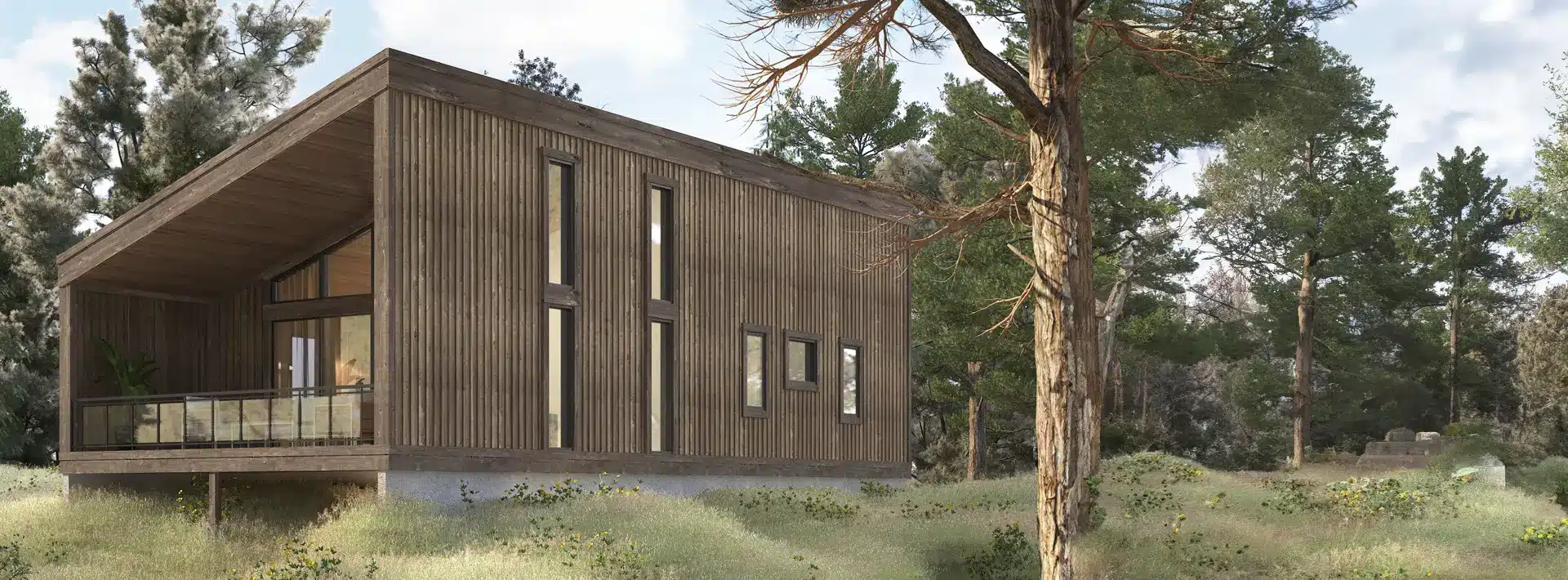 Modern wooden cabin with vertical slats and large windows, on a concrete base, surrounded by meadow and tall pine trees under clouds.