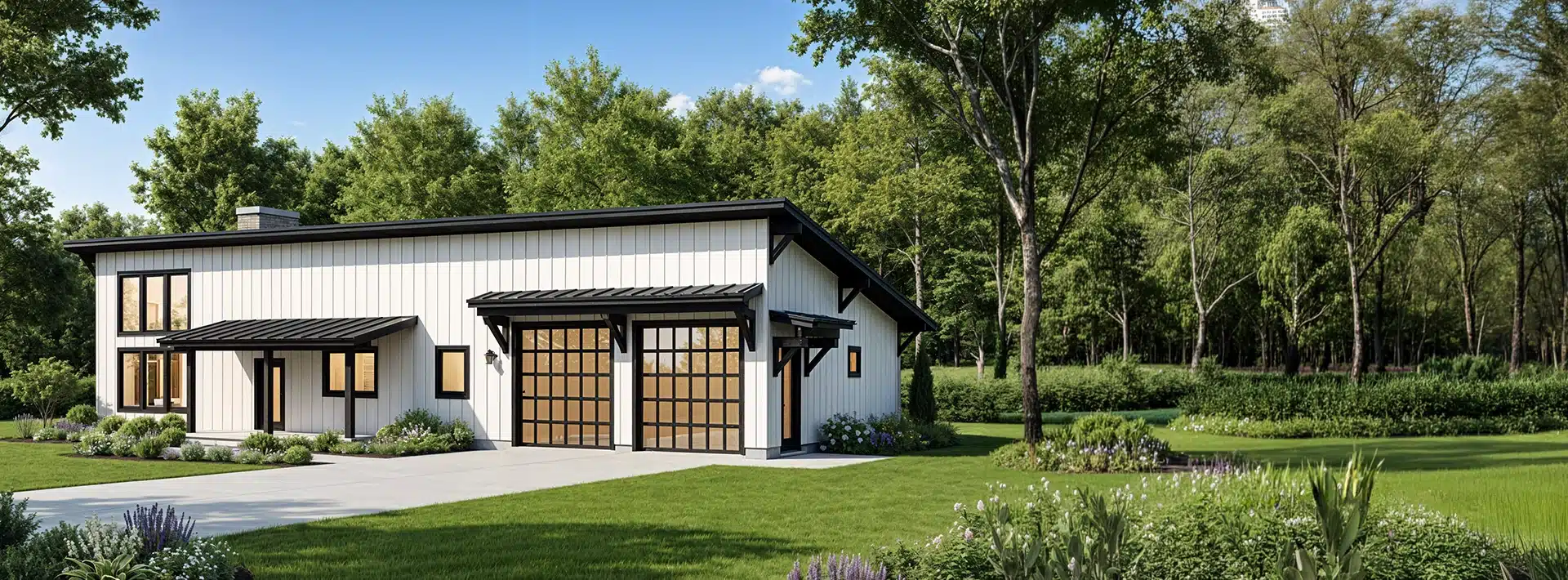 Modern white barn-style house with black trim, glass garage doors, many windows, and a neat lawn amid trees on a sunny day.