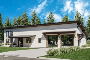 Modern single-story house with a sloped roof, large windows, and white siding, surrounded by grass, shrubs, and pine trees under a blue sky.