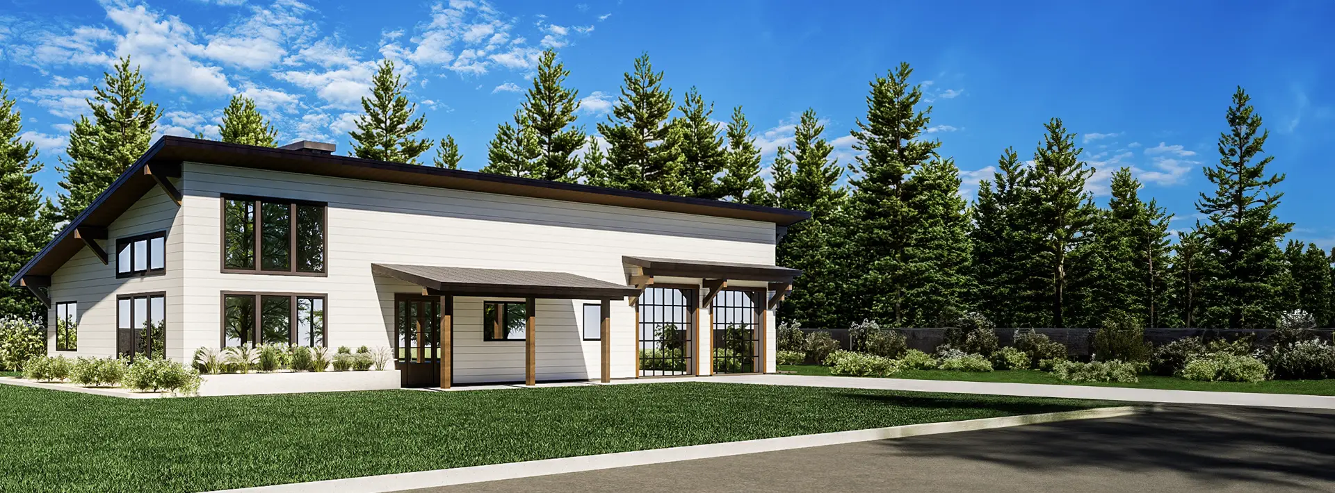 Modern white house with large windows and a slanted roof on a manicured lawn, surrounded by tall pines under a blue sky.