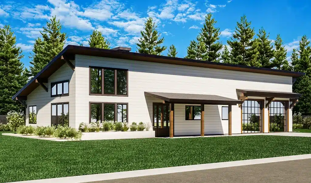 Modern single-story house with white siding, large windows, and dark trim. Sloped roof, covered entry, grass and pine trees under blue sky.