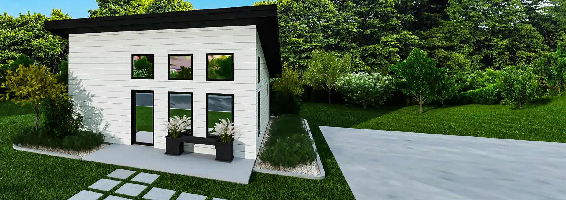 Modern small white house with large windows and a slanted black roof, surrounded by lawn, shrubs, trees, and a concrete driveway.